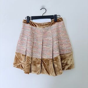 NWT tweed mini skirt featuring a multicolored woven pattern, pleated design, and